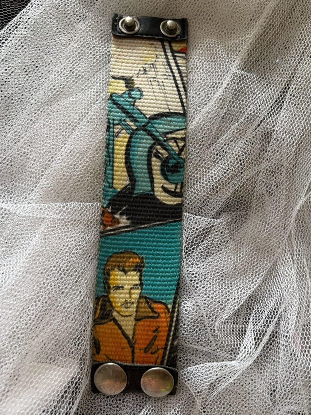 Vintage Truth Multicolor Graphic Snap Wristband in Teal, Yellow, Red, Black